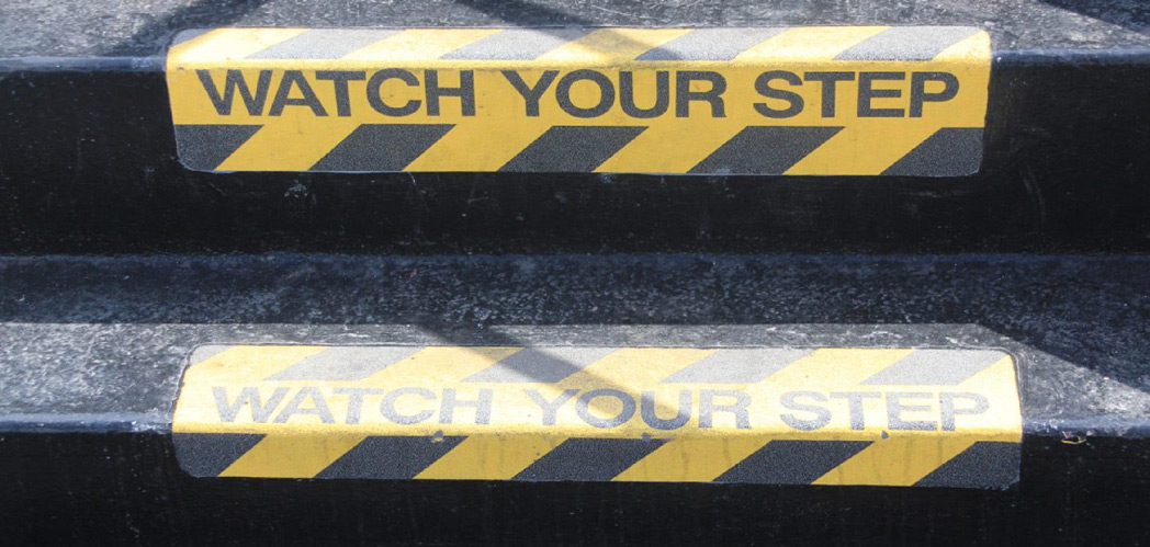 Yellow-Watch-Your-Step-signs-on-stairs